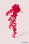 41" Fuchsia Pink Cascading "Spring Blossom" Spray – Extra-Full Silk Floral Waterfall from ShopWildThings.com shown as a full faux floral waterfall on a soft blush studio background, featuring fuchsia pink blossoms, bendable stems, and a long cascading silhouette.