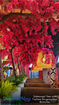 Oversized artificial Sideswept Trees from ShopWildThings decorated with vibrant fuchsia pink Bougainvillea Replacement Branches, installed in a modern restaurant to create a dramatic floral ceiling canopy for bold interior design impact