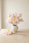 Light blush pink artificial cherry blossom branches arranged in a textured white vase with one 38 inch branch displayed on tabletop, ShopWildThings.com