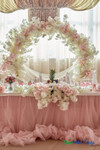 Create a Gorgeous Backdrop Arch with Dogwood and Cherry Blossom Silk Florals in Pinks and Creams and a Round Arch, all available at ShopWildThings.com – Pink and Cream Spring Wedding Reception Head Table Party Decor