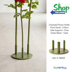 Oversized red artificial roses displayed in Olive Green Triple Support Flower Stand in minimal room setting with detail inset of base ShopWildThings.com