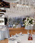 From Ceiling to Backdrop, Fringe String Curtains by ShopWildThings.com Can Do It All! Create a stunning backdrop or add a touch of magic to your ceiling. Choose from our ready-to-go colors or customize them to match your event perfectly. Need Fire Rated Decor? We offer FR String Curtains as Well!

White and Red Wedding Reception Decor with String Fringe Curtains Ceiling Decor
