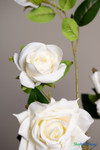 White velvet artificial rose branch displayed beside a removable artificial tree trunk, highlighting the 1.5-inch metal housing used for inserting branches into flowering tree trunks.
