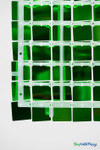 Back side of Emerald Green Shimmer Sequin Wall Panel showing durable clear snap-together plastic grid backing and mounting holes – ShopWildThings modular shimmer wall panel