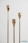 Elegant long stem gold metal taper candle holder set of three with modern minimalist design for wedding centerpieces and table decor
