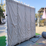 back view of 8x8 fabric backed flower wall with rod pocket top, easy roll-up floral backdrop, ShopWildThings.com