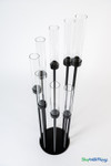 Overhead view of Black Stem Cluster 42 inch candelabra showing 8 tiered glass hurricane cylinders from ShopWildThings.com