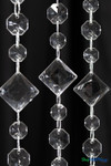 High grade acrylic crystal beaded curtain close-up featuring 1 inch faceted square beads, 1/2 inch octagon beads, and metal jump ring connections for event backdrops