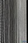Full length faux metal ball chain curtain backdrop creating sparkling photo background at formal event