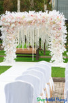 ShopWildThings Party Swirl Crystal Iridescent Chandeliers Adorning a Backdrop Wedding Arch