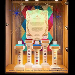 Golden Blonde Nassau String Curtains by ShopWildThings as background in a store window display. Fringe curtains are easy to cut to length to customize any space!