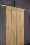Angled close-up of gold metallic string curtain with sparkling strands and woven top header – ShopWildThings.com