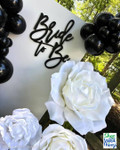 Bride to Be Backdrop with Black Balloons & White Jumbo Roses
Create striking black-and-white bridal decor with Jumbo Roses from ShopWildThings. This “Bride to Be” backdrop pairs cascading black balloons with oversized white roses for bold contrast—perfect for bridal showers, engagement parties, or bachelorettes. Shop 5 sizes and 11 colors (50+ roses in stock) to match any theme.