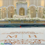 Gorgeous Wedding Reception Stage Decor with Chandeliers
"Tillie" Empire Swag Chandeliers to create this jaw-dropping wedding backdrop. Crafted with premium acrylic crystals, these chandeliers add glamour and sophistication to any space. Available at ShopWildThings.com

Want even more options? Explore our "Millie" collection for real crystals or the "Savoy" collection for elegant white pearls. Each collection offers three sizes to fit your design needs.