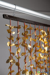 Metallic Gold FabuLush Hanging Silk Floral Curtain with gold fabric leaves and natural bamboo accents, 35 inches wide by 5.5 feet long, ShopWildThings.com.