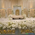 Gorgeous Wedding Reception Stage Decor with Chandeliers
"Tillie" Empire Swag Chandeliers to create this jaw-dropping wedding backdrop. Crafted with premium acrylic crystals, these chandeliers add glamour and sophistication to any space. Available at ShopWildThings.com

Want even more options? Explore our "Millie" collection for real crystals or the "Savoy" collection for elegant white pearls. Each collection offers three sizes to fit your design needs.