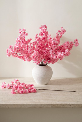 ShopWildThings Artificial Silk Dogwood Branch 36 inch pink floral arrangement in ceramic vase with single branch on table