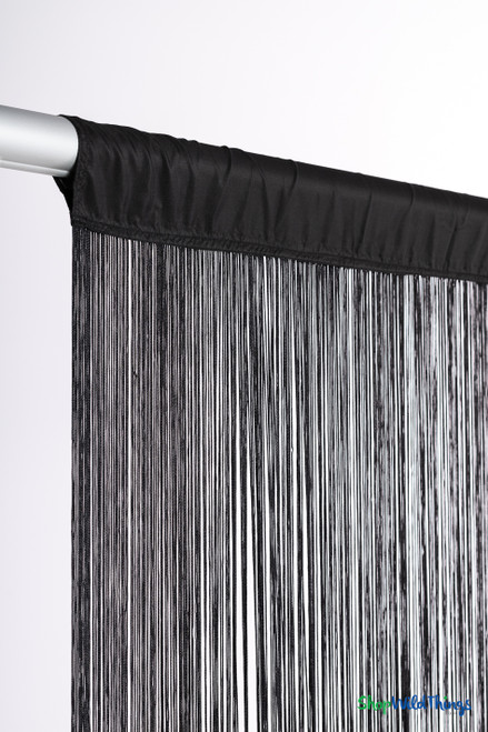 Side perspective of black fringe curtain from ShopWildThings emphasizing even strand spacing and premium event-grade texture.