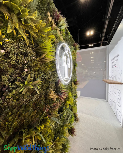 With over 2 dozen styles, shapes, and sizes of Artificial Greenery Walls in stock and ready to ship from Arizona, ShopWildThings has everything you need to create an installation of your dreams- indoors, outdoors, by the bar, and even FR options for retails and commercial settings.

Fantasy Courtyard Faux Greenery Wall – Exhibitor Decor Trade Show Wall – by ShopWildThings.com