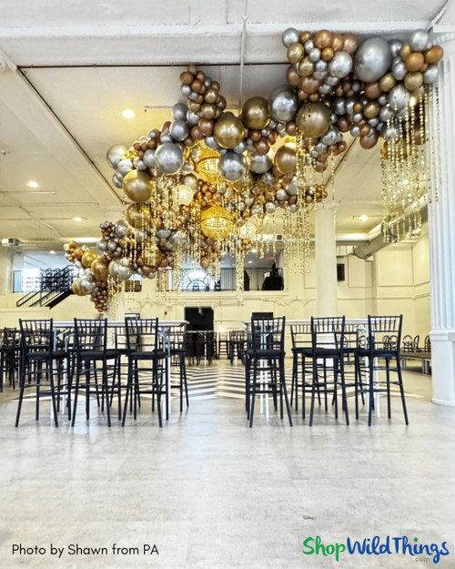 Mixed Metals Balloons and Curtains Ceiling Decor for 40th Party
ShopWildThings "Kate" Beaded Curtains added shimmer to this chic 40th birthday ceiling installation. These lightweight PVC curtains with metallic circles and crystal beads are easy to customize for any event. Available in silver or gold as full beaded curtains or columns, plus more metallic PVC styles to mix and match.
Glam Gold Silver Bronze Copper Black Dance Floor Decor