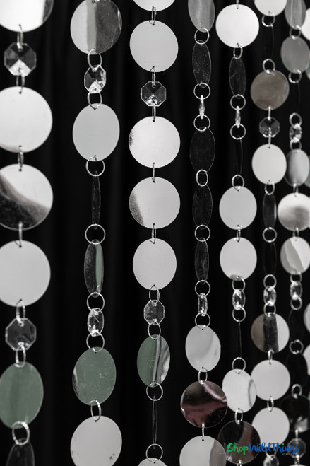 Close-up detail of 12 foot Kate beaded curtain showing 1.5 inch metallic PVC circles and 1/4 inch clear octagon beads linked by metal jump rings – ShopWildThings.com