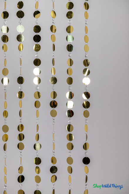 Hanging Metallic Gold PVC Discs and Clear Acrylic Crystals Make a Perfect Photo or Event Backdrop | ShopWildThings.com