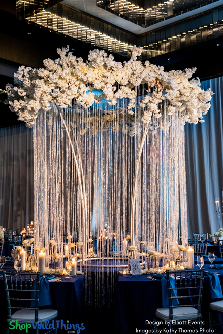 The “Funnel” Aluminum Frame by ShopWildThings makes for a fantastic over the top centerpiece, but when layered with Diamonds Beaded Iridescent Curtains, and Dogwood Branches- it goes to the next level!