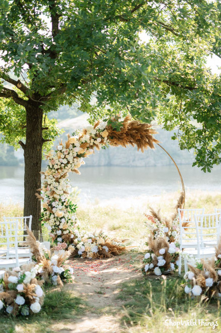 Pampas Grass Ceremony Backdrop Ideas
Transform any outdoor ceremony into a memorable event with a gold round arch covered in pampas grass, ivory and peach silk flowers, and lush greenery. ShopWildThings makes it easy for florists and event designers to build picture-perfect installations with Artificial Flowers in endless shapes, colors, and styles. With Pampas Grass, Greenery, and Arches, you can create layered, dimensional looks that stay beautiful from start to finish.