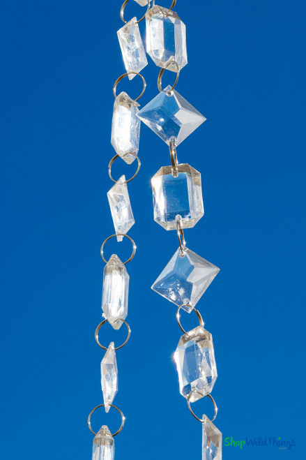 30 ft acrylic crystal beaded garland featuring emerald and diagonal princess cut beads, ideal for centerpieces, columns, and curtains from ShopWildThings.com