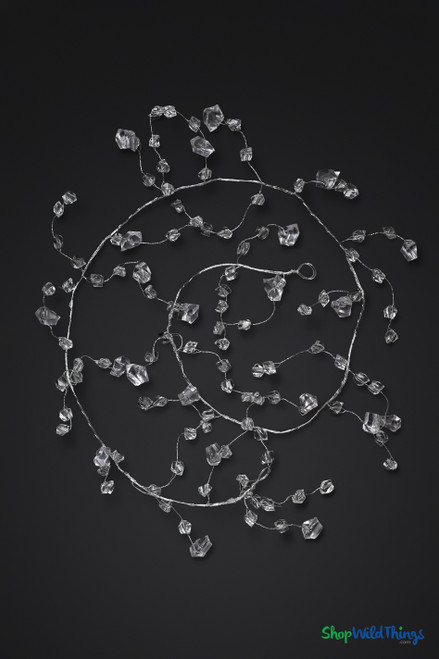 Clear crystal bead vine decoration featuring faceted acrylic beads on thin silver wire, shown draped naturally