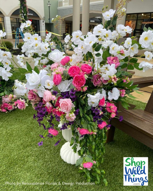 Create Bridgerton inspired floral arrangements with ShopWildThings.com! We have everything you need to get the look- Urns and Columns, plus over 600 Greenery Branches, plus a wide collection of Artificial Silk Floral Sprays, Stems, Branches, Garlands, and more!
Based out of Arizona, we have a wonderful team that can help you get the look you are going for- and get it delivered fast. 
Bridgerton Urn Pedestal Floral Arrangements with Silk Flowers and Greenery Sprays for Spring Weddings