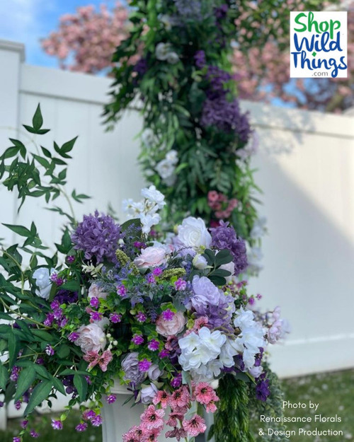Create Bridgerton inspired floral arrangements with ShopWildThings.com! We have everything you need to get the look- Urns and Columns, plus over 600 Greenery Branches, plus a wide collection of Artificial Silk Floral Sprays, Stems, Branches, Garlands, and more!
Based out of Arizona, we have a wonderful team that can help you get the look you are going for- and get it delivered fast. 
Bridgerton Urn Pedestal Floral Arrangements with Silk Flowers and Greenery Sprays for Spring Weddings