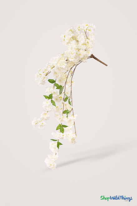 41" Cream White Cascading "Spring Blossom" Spray – Extra-Full Silk Floral Waterfall from ShopWildThings.com shown as a full faux floral waterfall on a soft studio background, featuring cream white blossoms, bendable stems, and a long cascading silhouette.