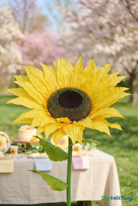 Close-up of extra large artificial sunflower with realistic yellow petals and textured center, oversized silk event décor flower for weddings and garden parties by ShopWildThings.