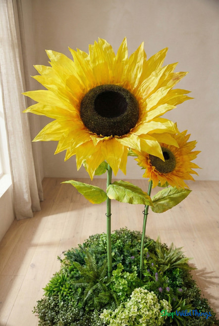 Close-up of extra large artificial silk sunflower bloom with realistic yellow petals and textured dark center, oversized event décor flower by ShopWildThings.