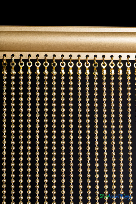 Detail of brass ball chain curtain header with 8mm metal strands attached to straight metal rod, USA-made by ShopWildThings.com