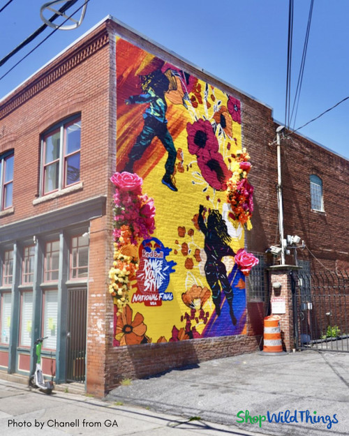 Fuchsia Pink Jumbo Roses by ShopWildThings.com in this outdoor mural!  While our giant florals are designed for indoor use (and treated with UV protectant spray), this project is pure inspiration.  
Shop our collection to bring big blooms to your home, office, spa, or any place that needs some cheering up. Our ready to use Giant Roses and Peonies have been selling fast, so order yours today!