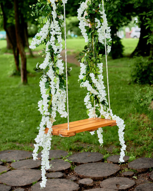Artificial Greenery Garlands and Florals by ShopWildThings.com are the perfect way to bring the beauty of nature indoors or out. Filter by color and style to find the perfect match for your next photo shoot or event.
Romantic Swing with Wisteria Vines Photoshoot Decor Ideas