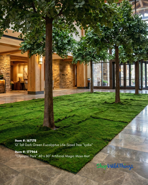 Artificial Magic Moss green wall panel mats used as forest floor ground covering around artificial trees in a luxury indoor venue installation – ShopWildThings.com