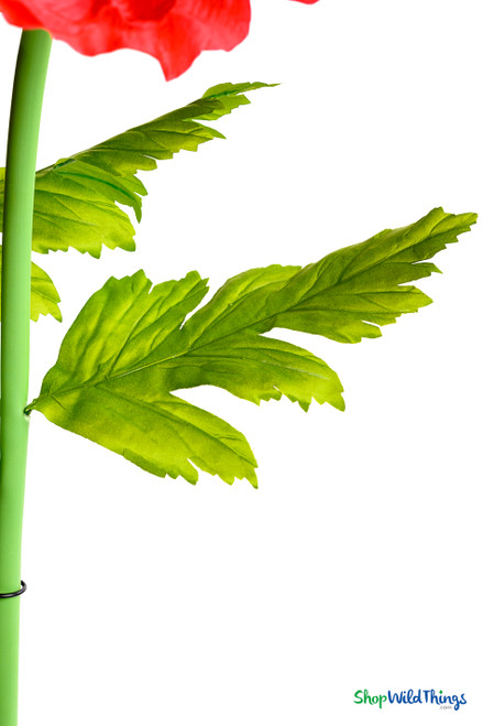 Leaf close-up of ShopWildThings.com Oversized Large Silk Poppy Bloom showing realistic green foliage with veined texture for authentic artificial floral arrangement.