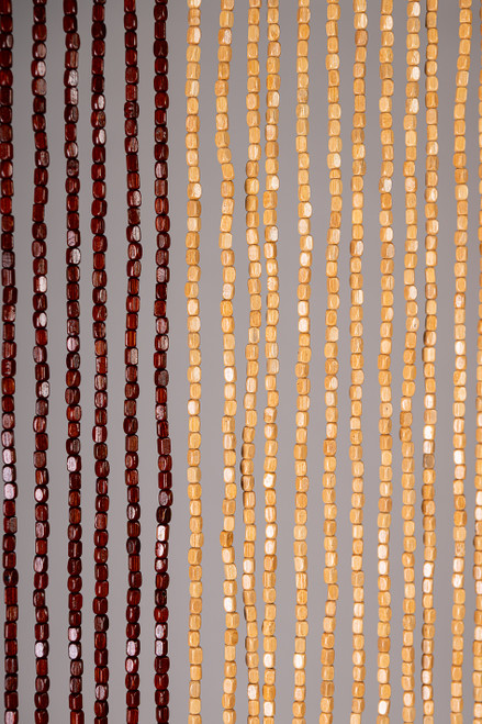 Handmade wooden bead curtain with natural tan, brown, and green beads forming dog bone design – 65 strands for doorway or wall décor.