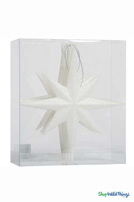 Packaged set of ShopWildThings 8” Star of Bethlehem 3-D ornaments, four white glitter hanging decorations neatly boxed for retail display.