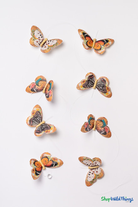 Full view of 6.5 ft “Madrid” feather butterfly garland with 13 orange and earth-tone butterflies evenly spaced on clear monofilament.