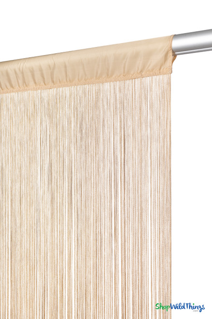 Close-up detail of Golden Blonde String Curtain rod pocket and fire-rated silky strands, showing texture and craftsmanship.