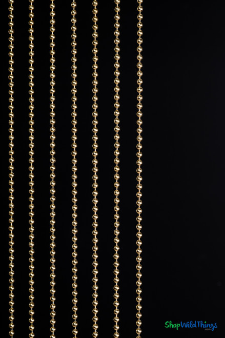 Brass gold 6mm metal ball chain curtains installed as luxury room dividers in a modern interior, fire rated decor from ShopWildThings.com