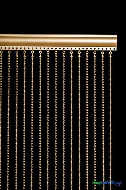 Detailed view of aluminum rod top and evenly spaced 6mm brass gold metal ball chains, fireproof curtain from ShopWildThings.com