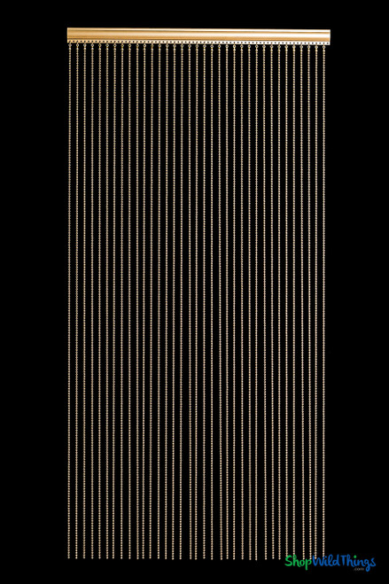 Brass gold 6mm metal ball chain curtains installed as luxury room dividers in a modern interior, fire rated decor from ShopWildThings.com