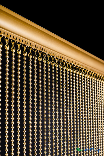 Detailed view of aluminum rod top and evenly spaced 6mm brass gold metal ball chains, fireproof curtain from ShopWildThings.com