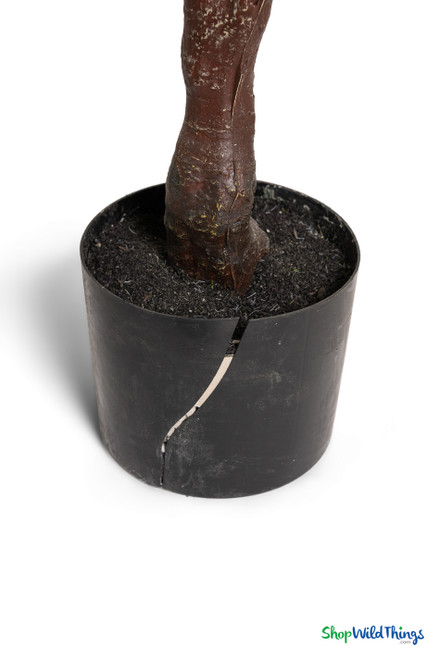 Artificial cherry blossom tree base shown in a black plastic nursery pot with visible crack, item sold as-is