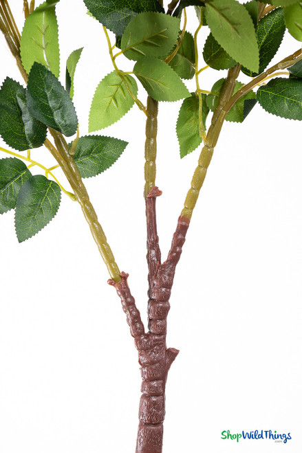 Detailed view of the brown lower stem and metal housing attachment on the red velvet artificial rose branch for inserting into artificial tree trunks.